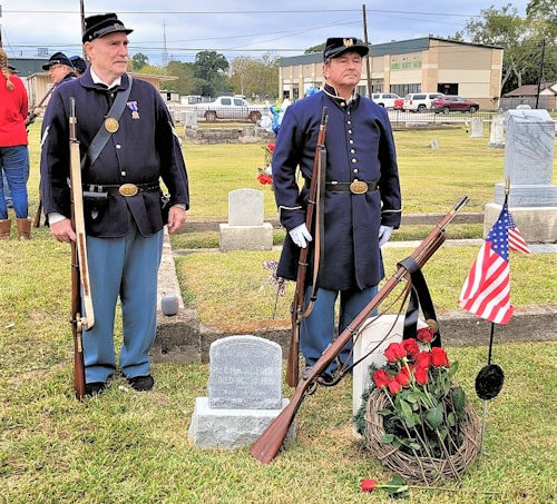 L-R: Michael Lance and Daniel Pourreau posing for photos behind the Carter grave after the ceremony.